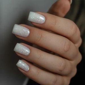 milky glitter manicure